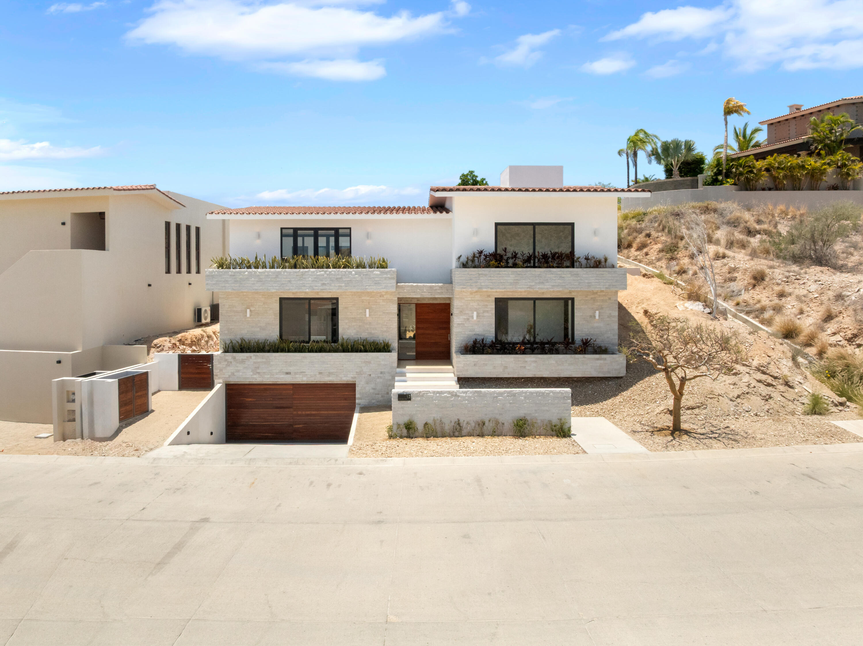 Los Cabos Cabo Colorado Discover modern luxury in this exquisitely designed home, built in 2020 and nestled within the exclusive, beachfront, private gated community of Cabo Colorado in San José del Cabo—just 2 miles from Palmilla Beach. Enjoy the convenience of living just steps from a stunning, sandy private beach within the community.With a striking contemporary aesthetic, this residence features gleaming white marble floors, beautifully appointed marble bathrooms, and captivating ocean for sale