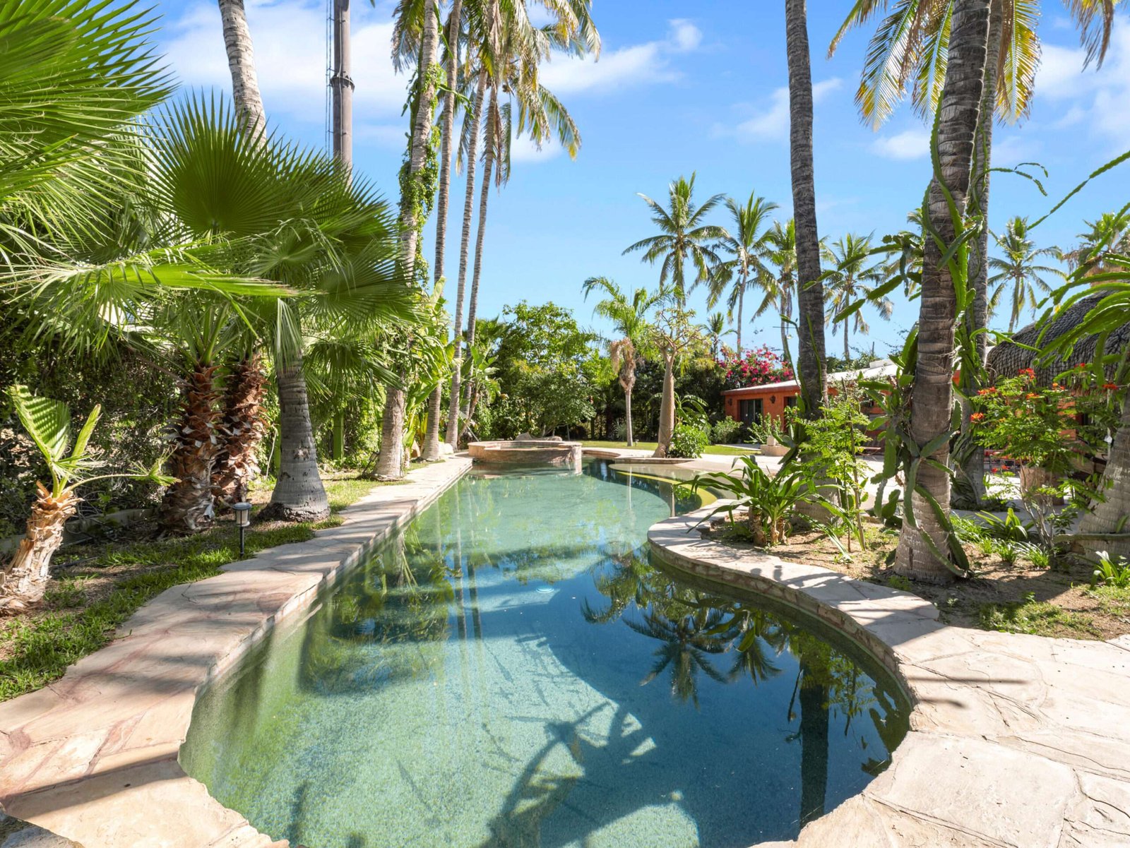 Los Cabos El Tezal-Oceanside:General Located along the highly sought-after Cabo Corridor, this charming 2-bedroom, 2-bathroom open-concept home is set within a lush, private garden oasis filled with mature tropical landscaping. The seamless indoor-outdoor layout flows effortlessly into a stunning lagoon-style pool, creating a peaceful, resort-like setting ideal for relaxing or entertaining.With its expansive grounds and prime location on the corridor just minutes from downtown Cabo San Lucas, the property offers incredible flexibility. Whether envisioned as a private residence, boutique event space and hotel, or future condo development, this is a rare opportunity to own a versatile property in one of Cabo's fastest-growing areas. for sale