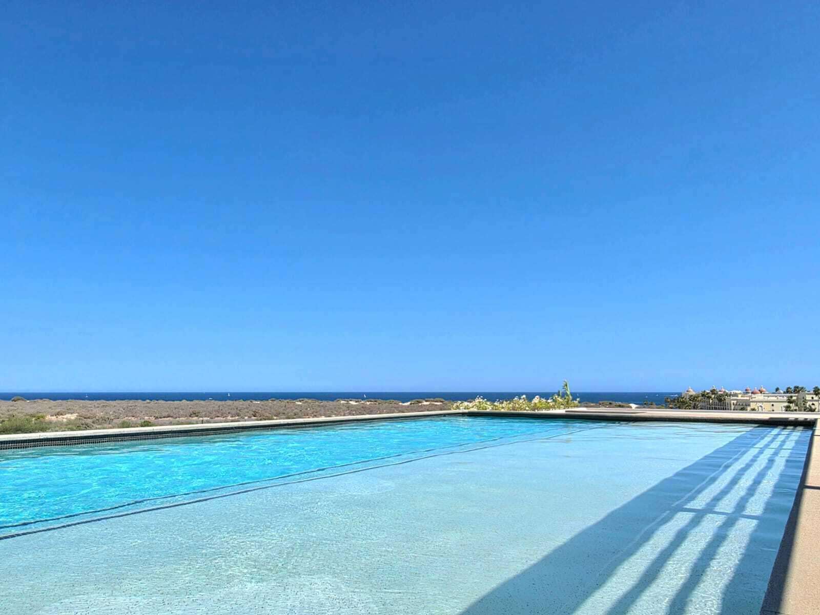 Los Cabos Amaterra Corner unit- Amaterra 304 D - is ideally located just 350 meters from Medano Beach, within the Amaterra Phase 2 building. This condo features 2 bedrooms and 2 full bathrooms, and is offered fully furnished and equipped, with one assigned parking space. It's a great option whether you're looking for a comfortable place to live or a property with rental potential.Residents enjoy access to a shared rooftop with a pool and beautiful for sale