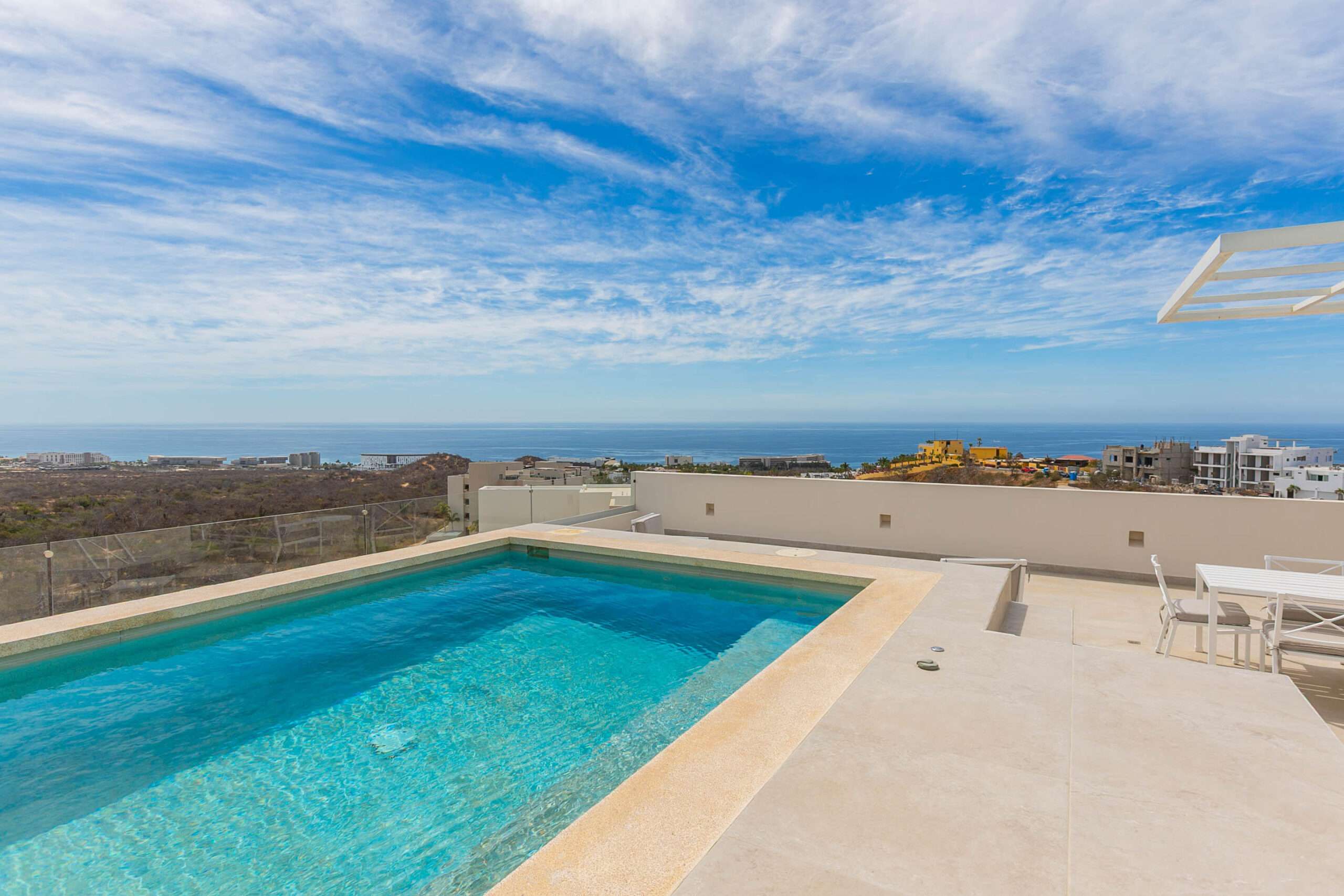 Los Cabos El Tule-Inland:General Located in one of El Tule's most relaxing communities, Vistamar Penthouse 2502 is a turnkey design masterpiece. This stunning residence features approximately 1,506 square feet of interior living space complemented by an exceptional 1,184 square feet of rooftop area, creating an expansive and airy atmosphere with breathtaking ocean and desert for sale